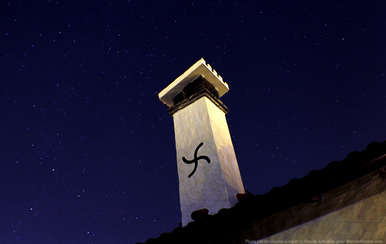 Bask cross and stars at night