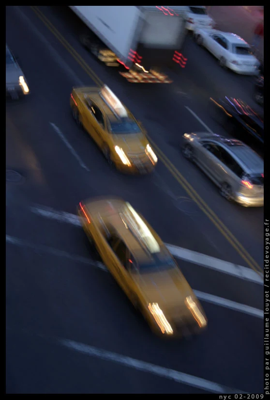Yellow taxis in motion, seen from above in New York